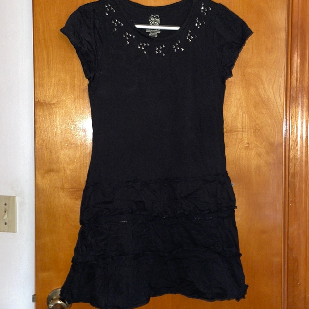 Black short sleeve dress with drop waist and ruffled skirt